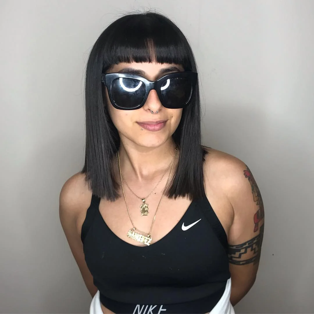 15 Chic Medium Length Hairstyles for Women 2026: Your Complete Style Guide 5 Blunt Cut with Bangs