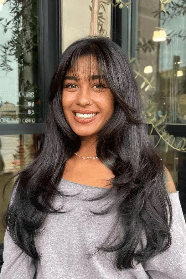 17 Long Layered Haircuts with Curtain Bangs Are Everywhere Now 4 Long Layers with Wispy Curtain Bangs