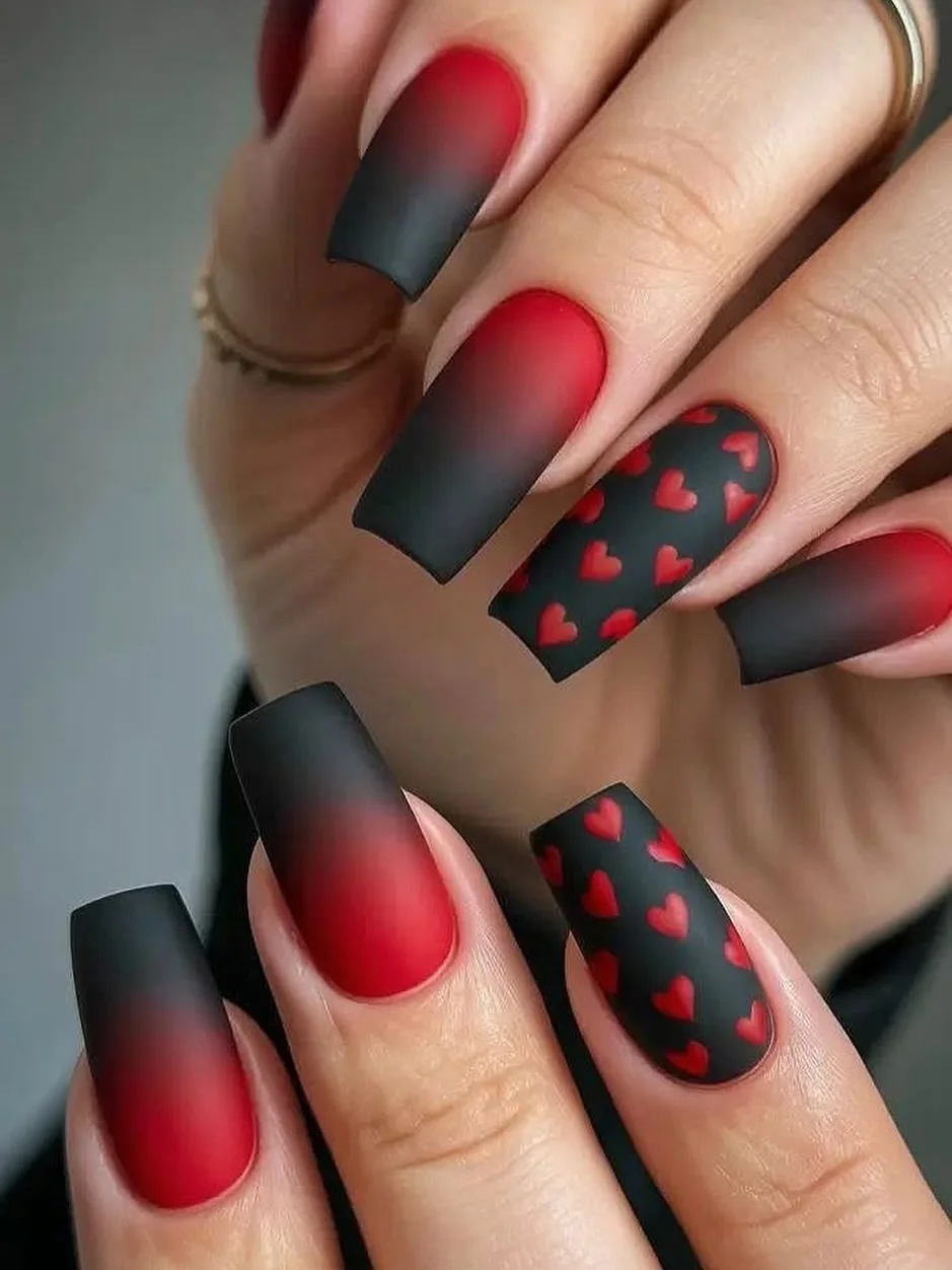 17 Nail Design Ideas February 2026: Fresh Looks That'll Make Everyone Ask "Where Did You Get Those Done?" 14 Matte Black with Red Hearts