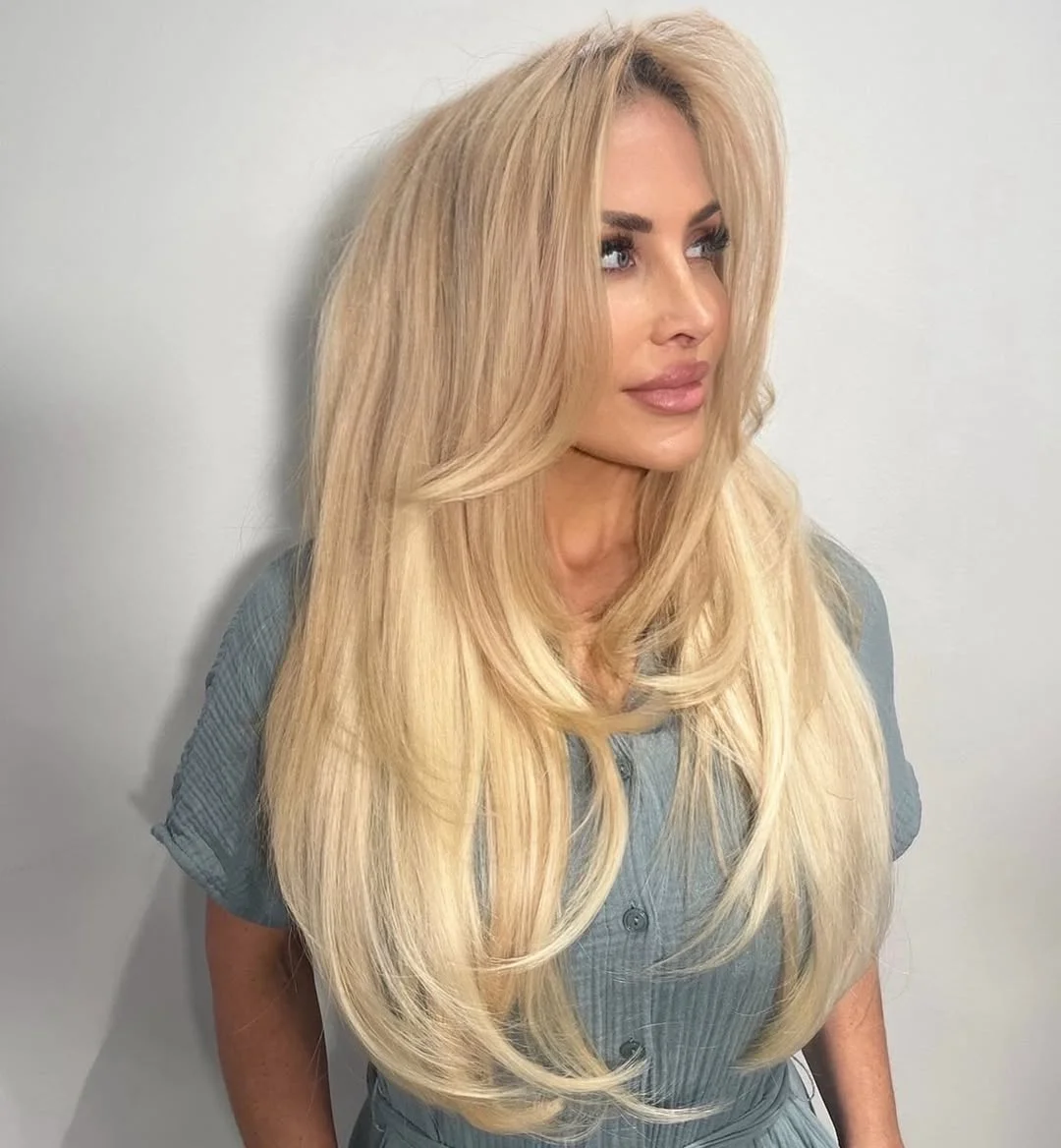 15 Chic Medium Length Hairstyles for Women 2026: Your Complete Style Guide 14 Voluminous Blowout Style