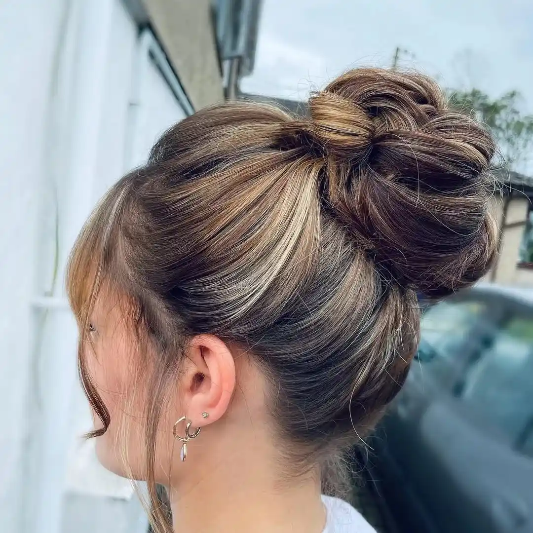 17 Hot Weather Hairstyles Ideas That'll Keep You Cool (Without Looking Like You Just Rolled Out of Bed) 2 The Classic High Bun