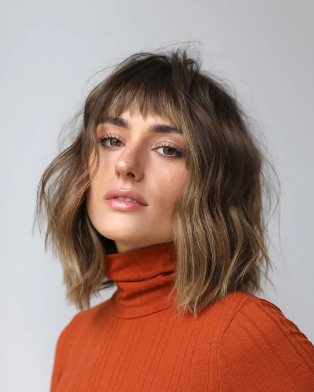 14 Curtain Bangs with Layers: The Ultimate Style Guide for Effortless Chic Looks 6 The Textured Lob with Curtain Bangs