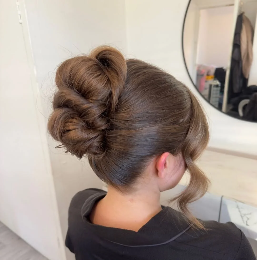 17 Hot Weather Hairstyles Ideas That'll Keep You Cool (Without Looking Like You Just Rolled Out of Bed) 15 The Twisted Low Bun