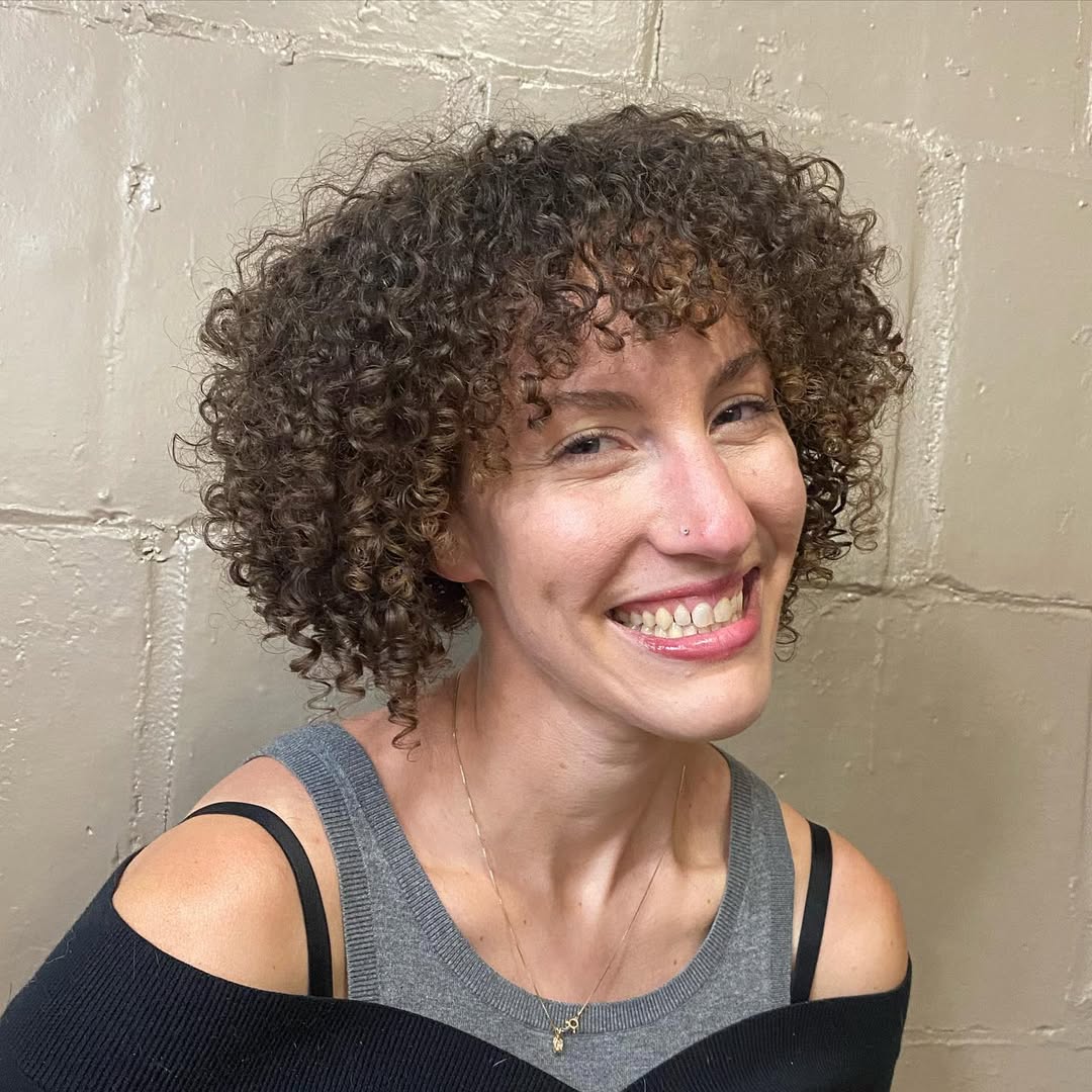 15 Short Curly Bob Hairstyles That’ll Instantly Make You Look Like That Girl 10 Angled Curly Bob