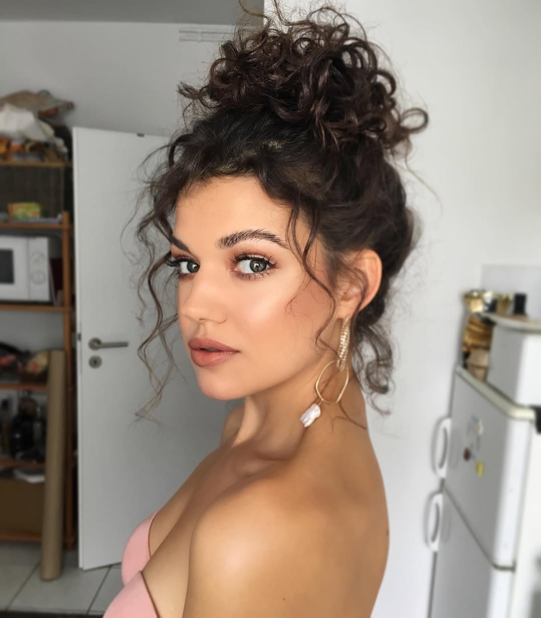 15 Curly Wedding Hairstyles That Will Make You Say “Wait… Why Didn’t I Do This Sooner?!” 12 Curly High Bun