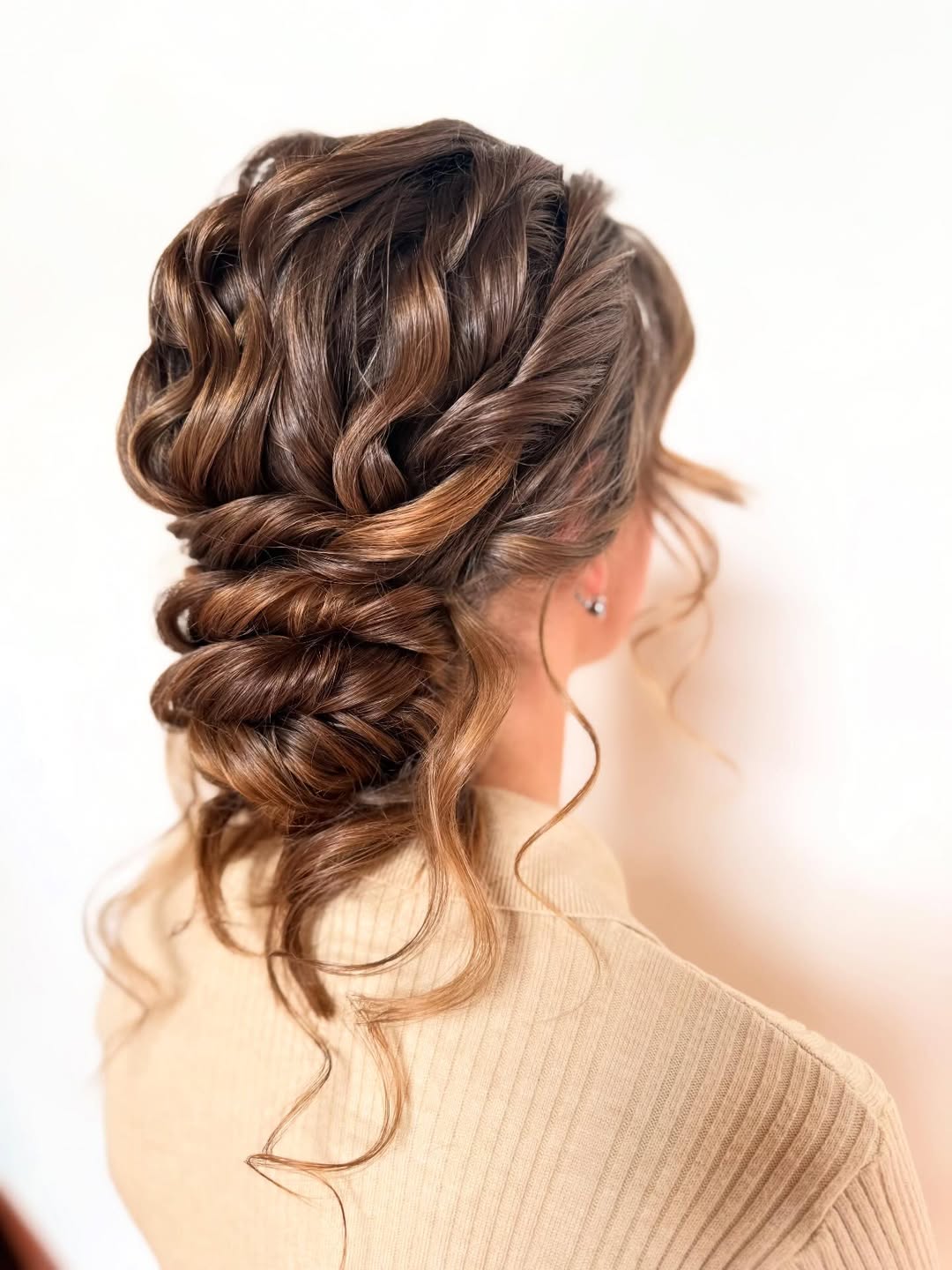 16 Curly Prom Hairstyles That Will Have You Serving Main Character Energy All Night 6 Curly Low Bun