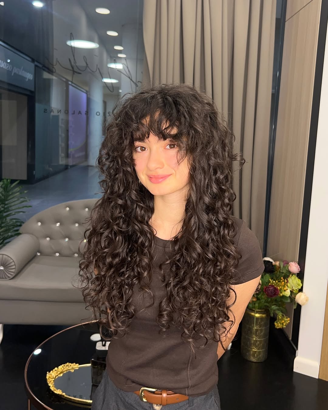 15 Unexpected Hairstyles With Bangs That Are Taking Over Pinterest 7 Curly bangs with layered curls