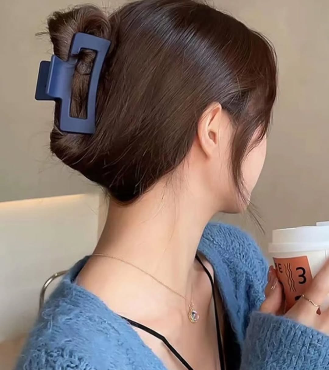 15 Curly Half-Up Half-Down Hairstyles That Are Too Cute Not to Try Right Now 6 Half-Up with Claw Clip