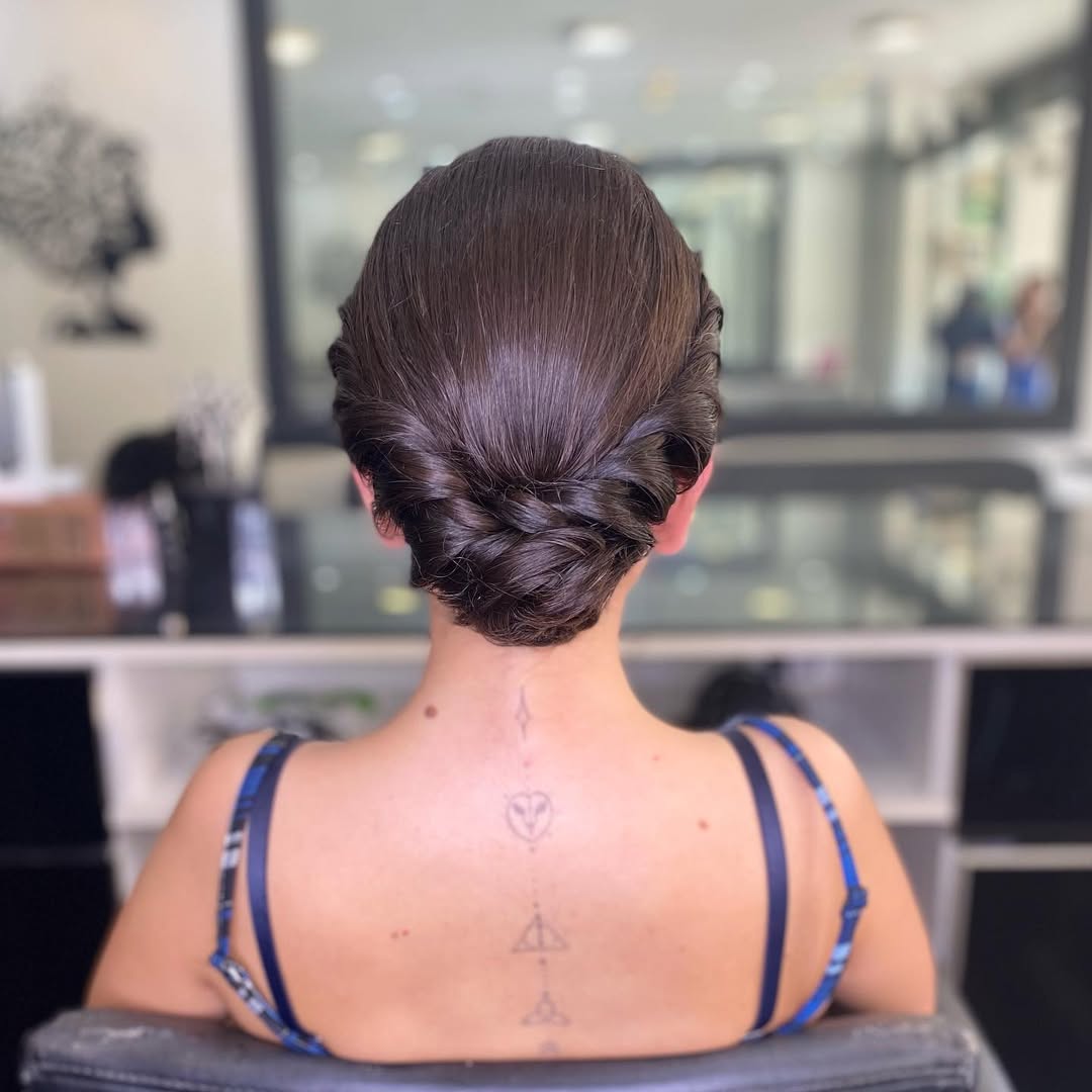 14 Work Hairstyle Ideas That Make You Look Effortlessly Put-Together (Even on 3 Hours of Sleep) 14 Low Braided Bun