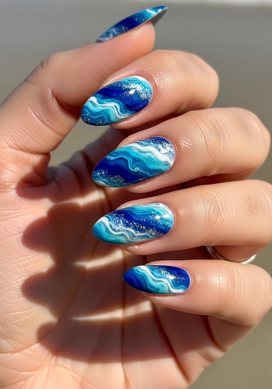 16 Summer Blooming Gel Nail Ideas That Are Basically Sunshine in Manicure Form 3 Ocean Marble Waves