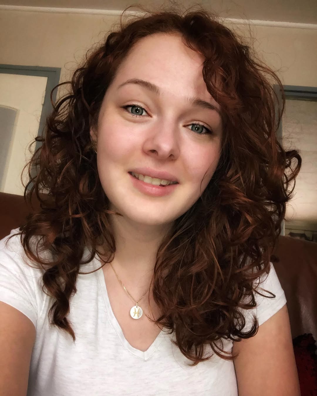 16 Short Curly Hairstyles for Women That Are Basically Effortless Chic 9 Side-Parted Curly Crop