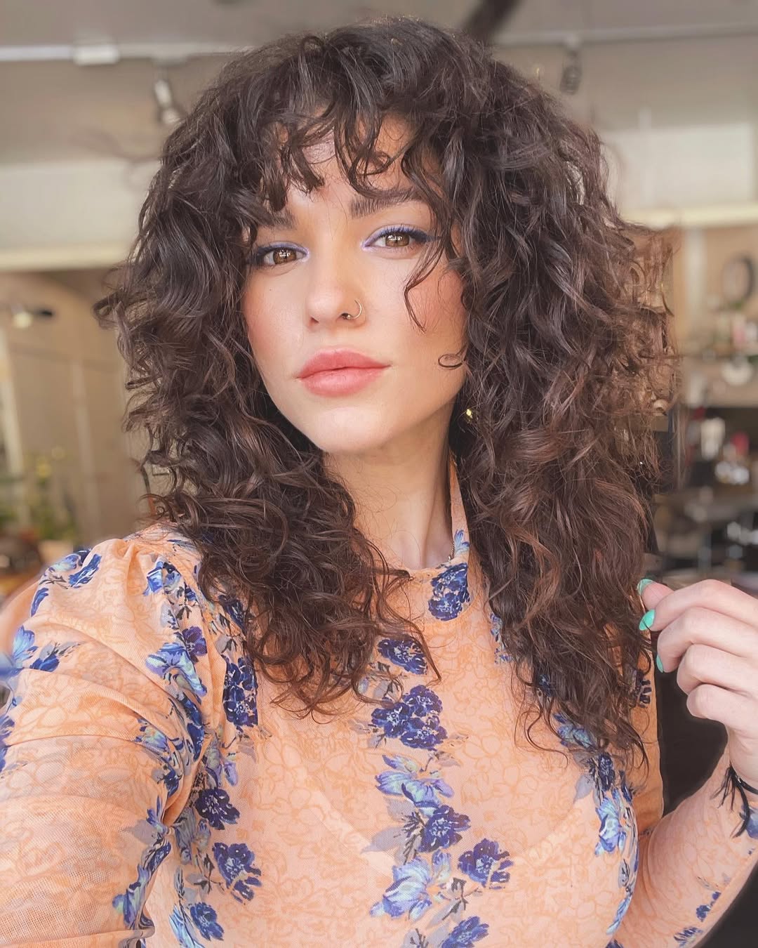 16 Short Curly Hairstyles for Women That Are Basically Effortless Chic 15 Soft Curly Fringe Cut
