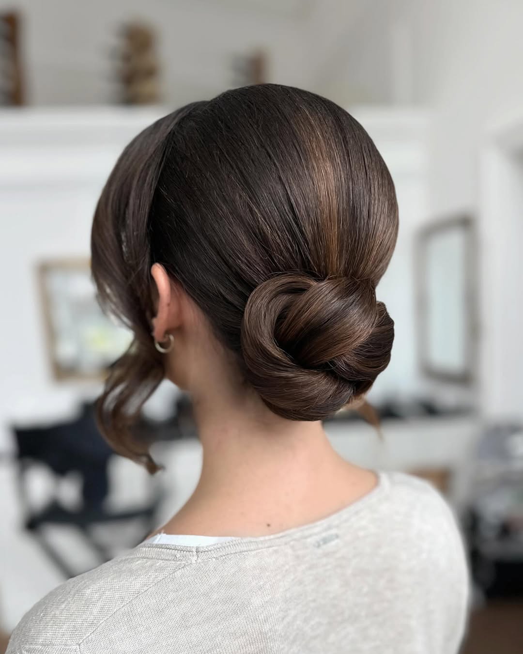 14 Work Hairstyle Ideas That Make You Look Effortlessly Put-Together (Even on 3 Hours of Sleep) 2 The Sleek Low Bun