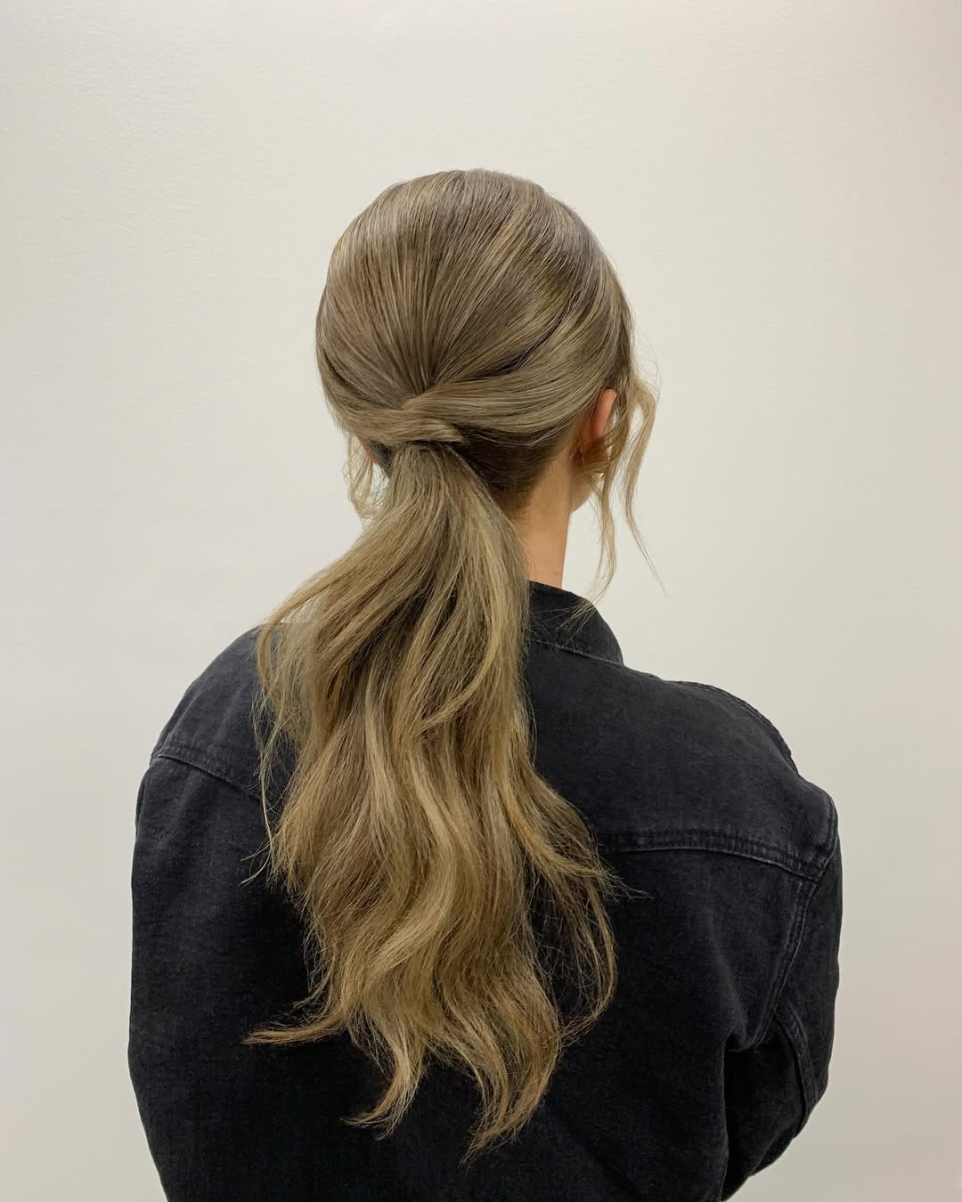 14 Homecoming Hairstyles Ideas That’ll Make You the Main Character All Night 13 Twisted Low Ponytail