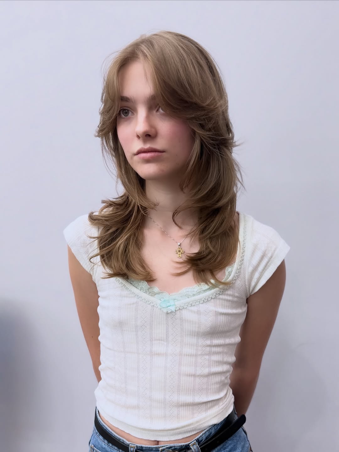 15 Round Face Hairstyles That Instantly Slim, Sculpt & Serve Main-Character Energy 10 Wispy Bangs with Long Hair