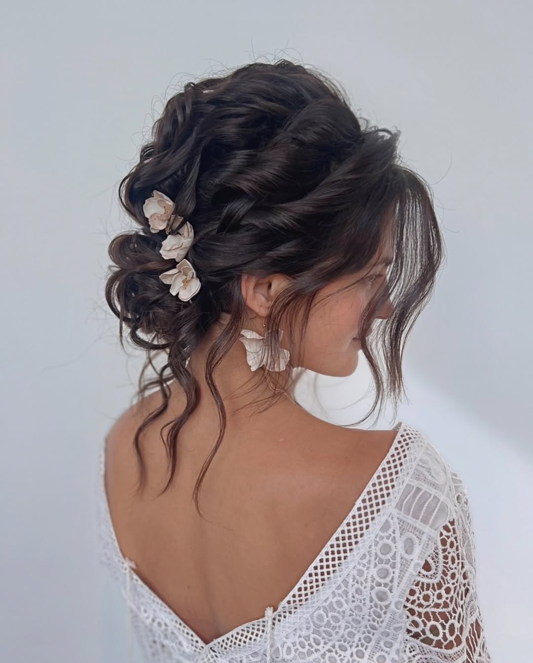 15 Curly Hairstyles for Medium Hair That Will Make You Ditch Your Straightener (Finally) 14 Curly Low Bun