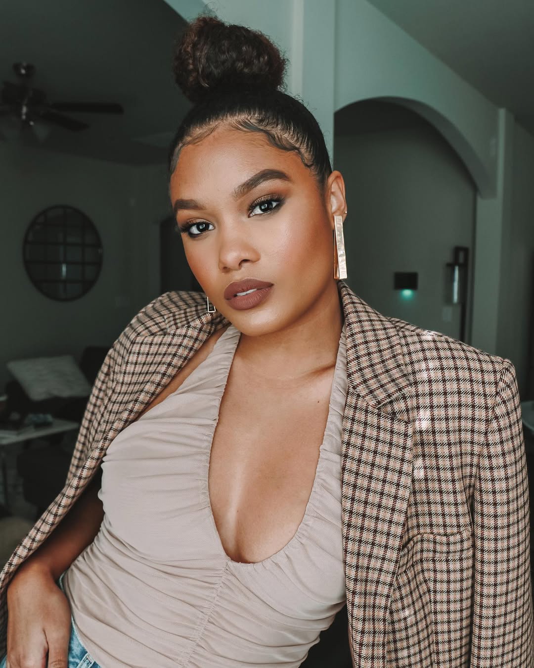 15 Curly Updo Hairstyles That Will Instantly Elevate Your Look (No Salon Required) 8 Curly Top Knot