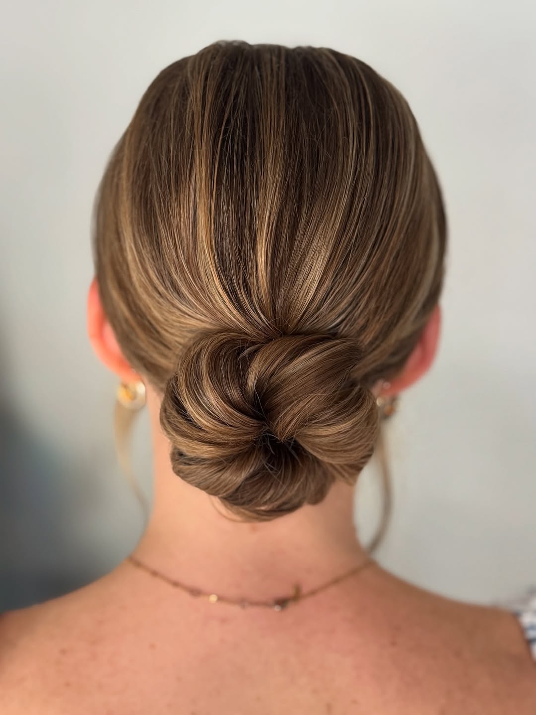 15 Curly Updo Hairstyles That Will Instantly Elevate Your Look (No Salon Required) 3 Low Twisted Bun