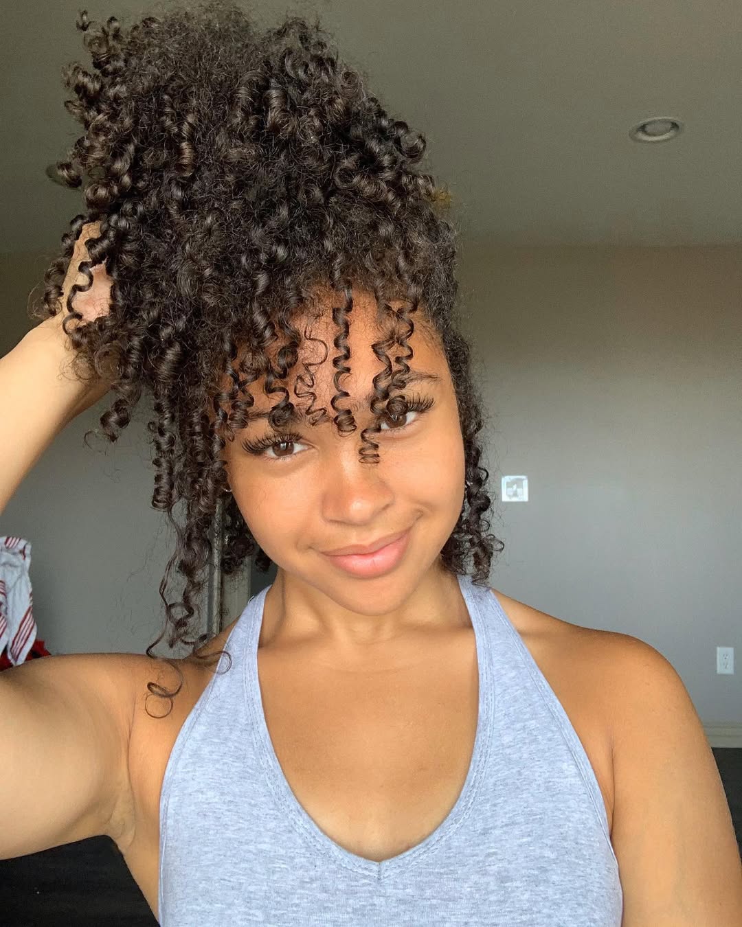 15 Curly Bun Hairstyles That Instantly Upgrade Your Look (No Effort, All Style) 9 Pineapple Curly Bun