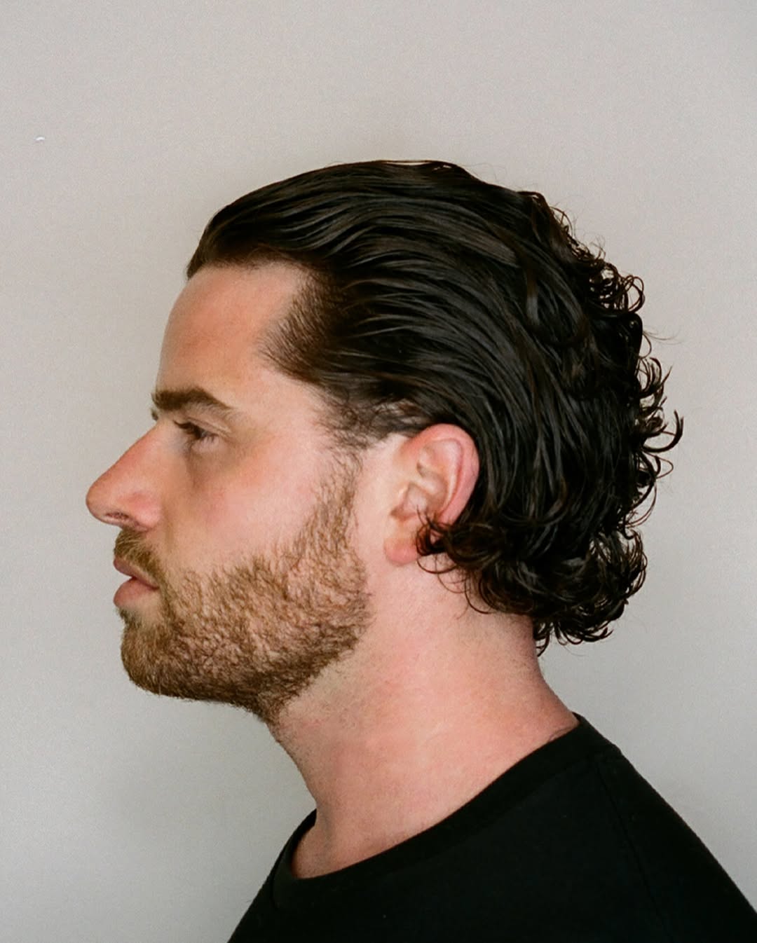 14 Natural Curly Hairstyles That Will Instantly Upgrade Your Vibe (No Heat, No Stress) 13 Slicked-Back Curly Pony