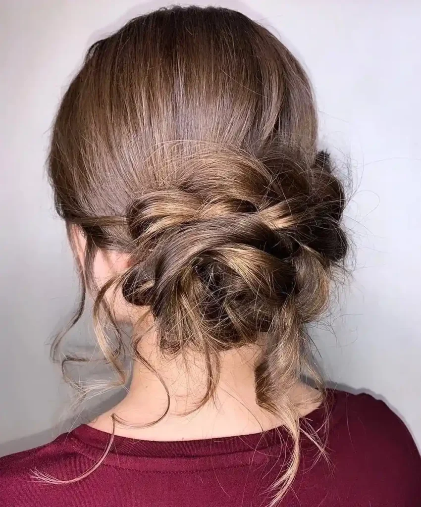 15 Boho Hairstyle Ideas That Are Giving Effortless Cool-Girl Energy in 2026 8 Floral Braided Updo