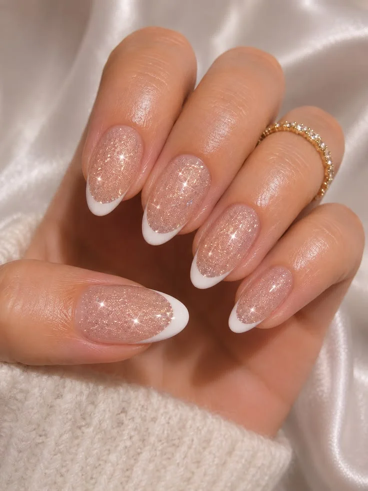 16 Baby Pink Nails That Are So Dreamy, You'll Want to Ditch Every Other Shade 7 Glitter Dusted Tips