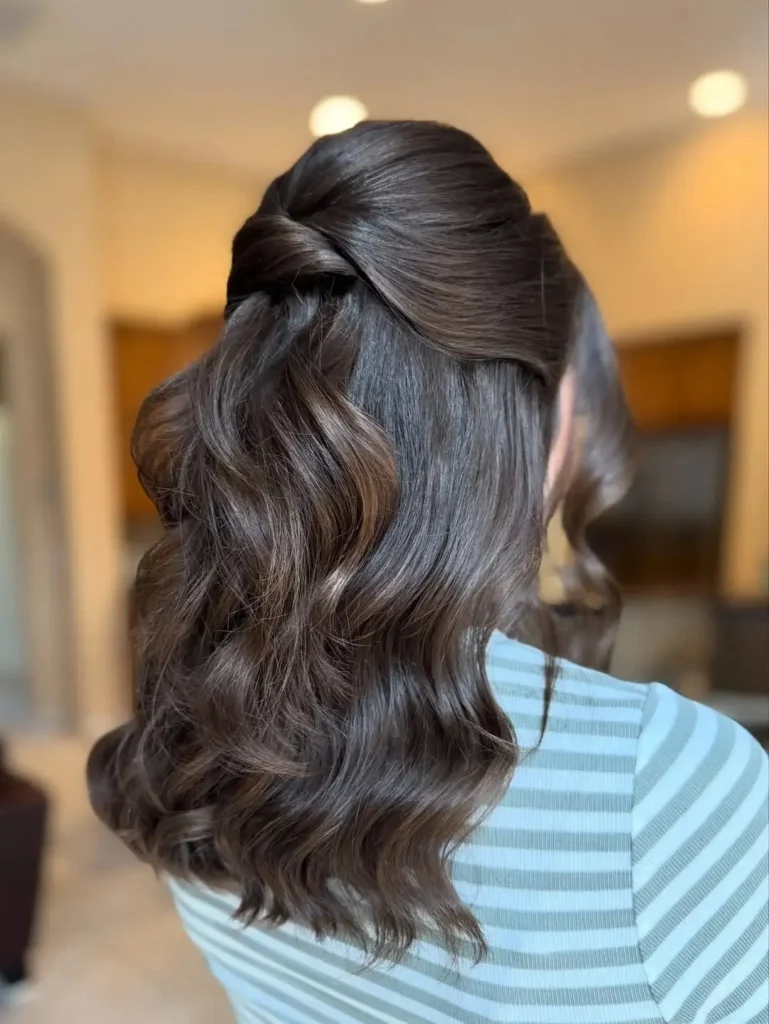 16 Vacation Hairstyles That'll Make You Look Effortlessly Gorgeous (Even After a 10-Hour Flight) 4 Half Up Half Down With a Twist
