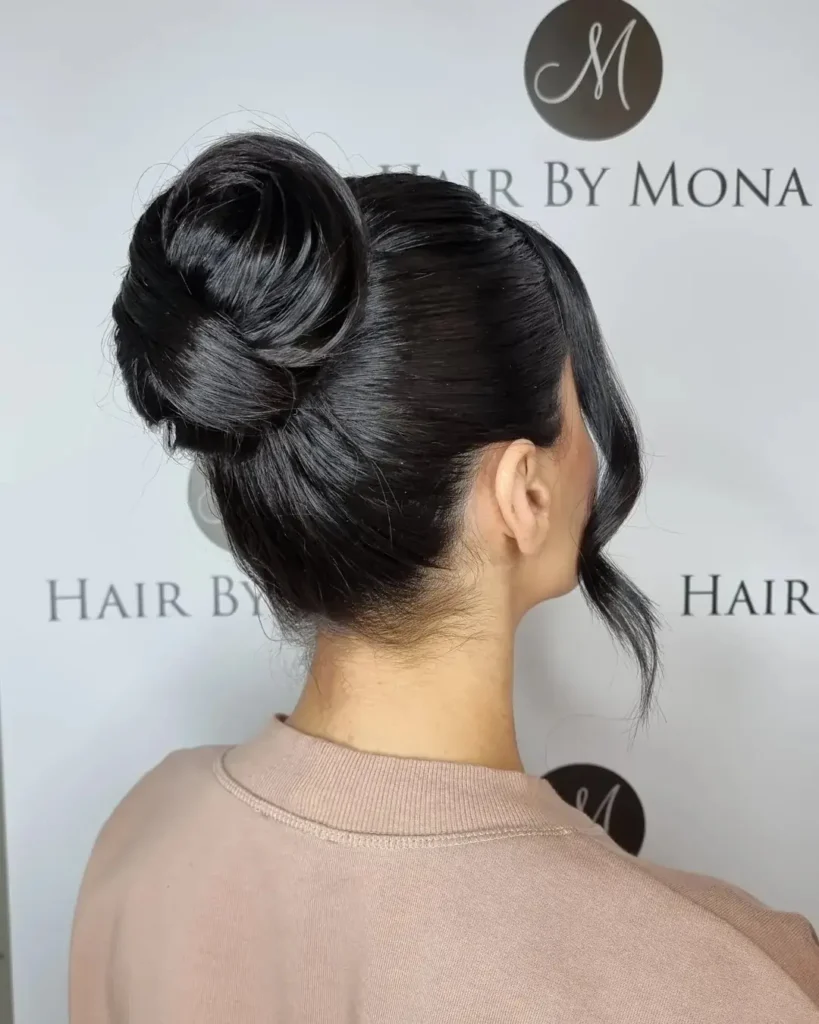15 Cheer Hairstyle Ideas That’ll Make You Look Game-Day Ready in Seconds 9 High Bun With Bow