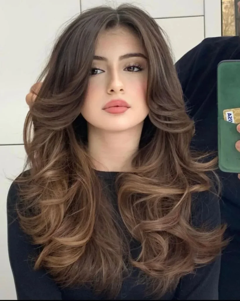 15 Boho Hairstyle Ideas That Are Giving Effortless Cool-Girl Energy in 2026 2 Loose Boho Waves with Curtain Bangs
