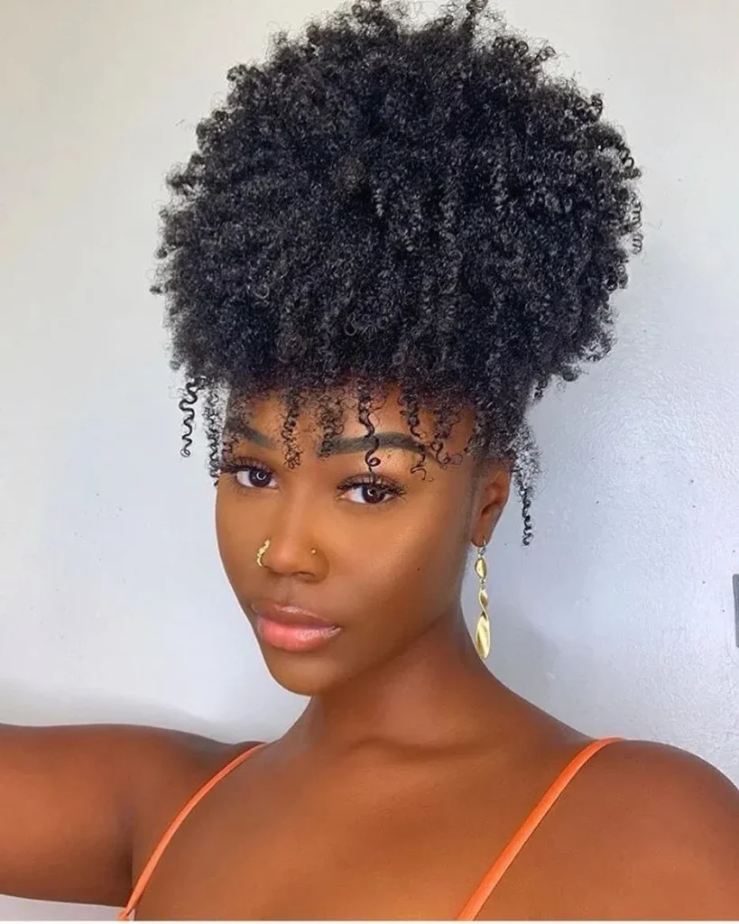 16 Vacation Hairstyles That'll Make You Look Effortlessly Gorgeous (Even After a 10-Hour Flight) 14 Pineapple Updo