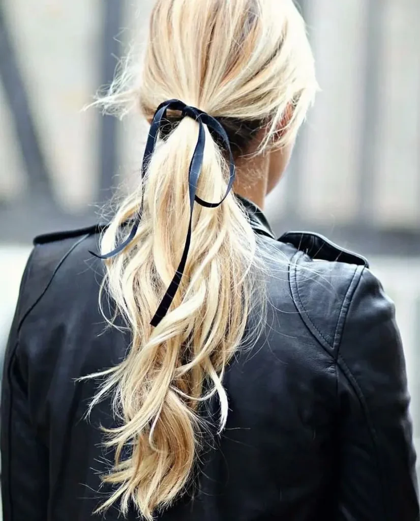 15 Cheer Hairstyle Ideas That’ll Make You Look Game-Day Ready in Seconds 12 Ribbon Wrapped Ponytail 1
