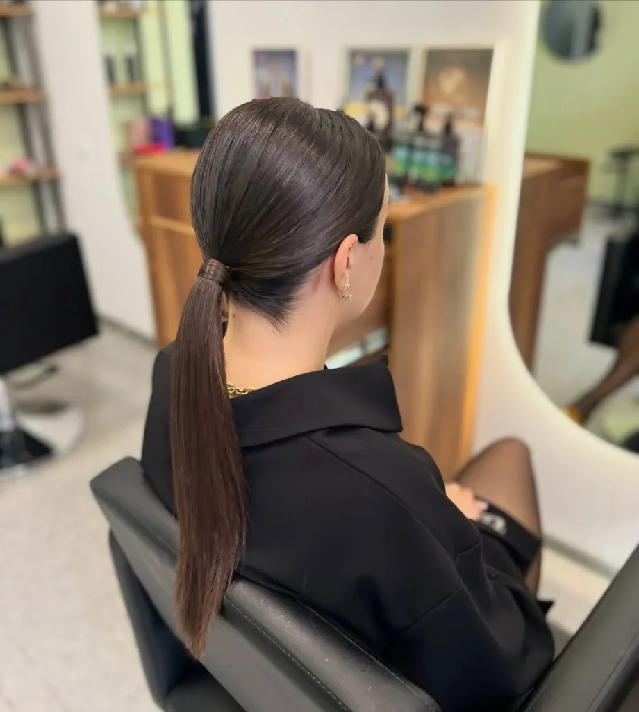 15 Cheer Hairstyle Ideas That’ll Make You Look Game-Day Ready in Seconds 7 Sleek Low Ponytail