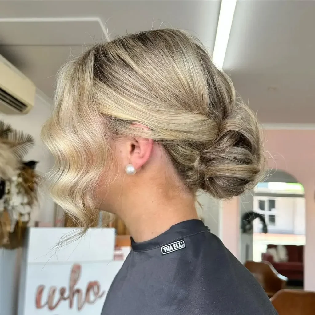 15 Boho Hairstyle Ideas That Are Giving Effortless Cool-Girl Energy in 2026 5 Textured Low Bun with Face Framing Pieces