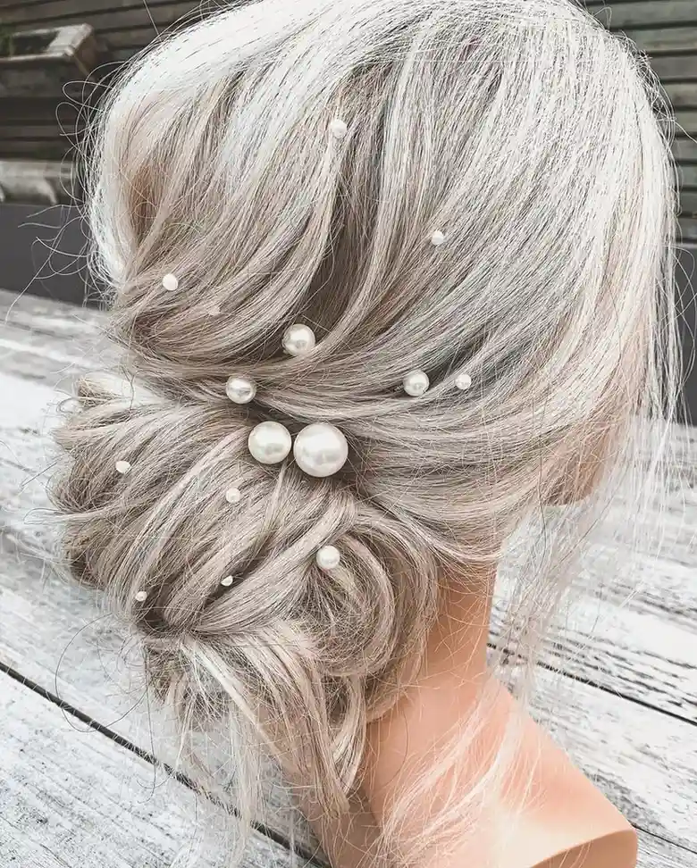17 Fancy Hairstyles That'll Make You Look Like You Actually Tried (Without Trying Too Hard) 16 Textured Top Knot With Pearl Pins