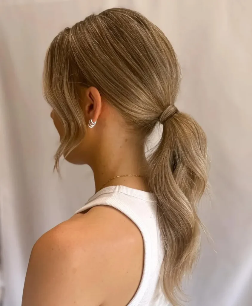 16 Vacation Hairstyles That'll Make You Look Effortlessly Gorgeous (Even After a 10-Hour Flight) 3 The Classic Low Ponytail