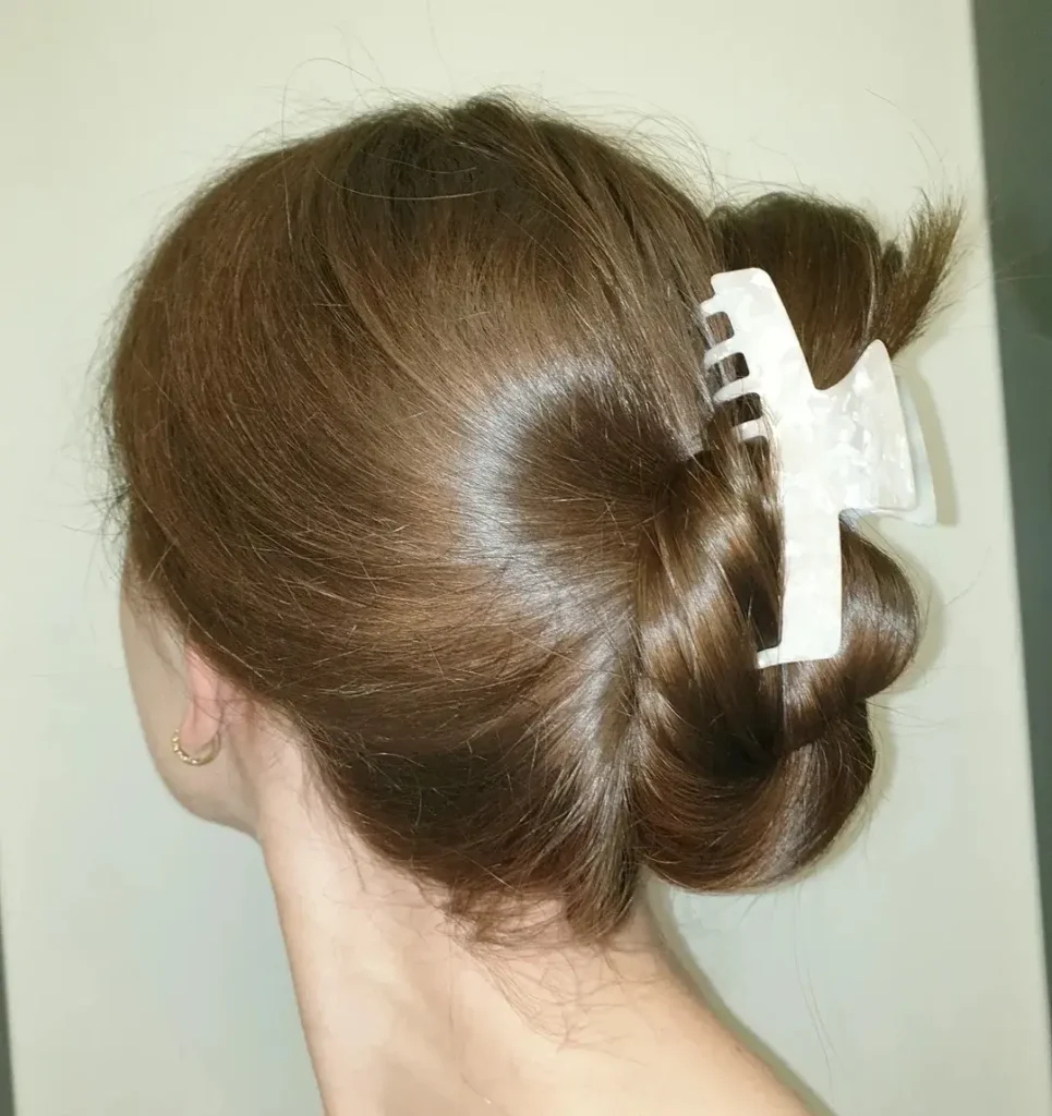 16 Vacation Hairstyles That'll Make You Look Effortlessly Gorgeous (Even After a 10-Hour Flight) 10 The Claw Clip Updo