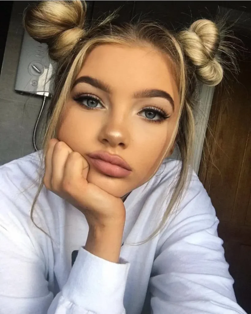 16 Gymnastics Hairstyles That'll Have You Flipping With Confidence (Literally) 2 The Sleek Double Bun