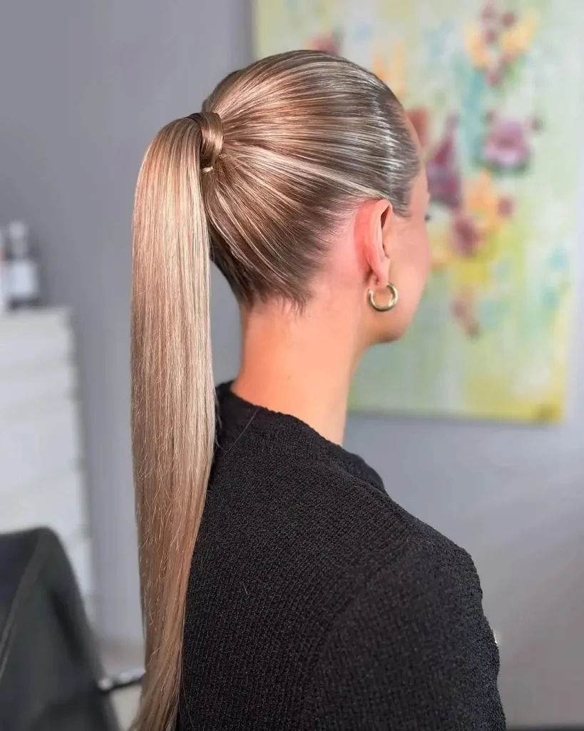 16 Vacation Hairstyles That'll Make You Look Effortlessly Gorgeous (Even After a 10-Hour Flight) 8 The Sleek High Ponytail