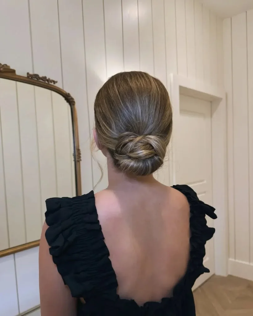 17 Fancy Hairstyles That'll Make You Look Like You Actually Tried (Without Trying Too Hard) 2 The Sleek Low Bun With a Twist