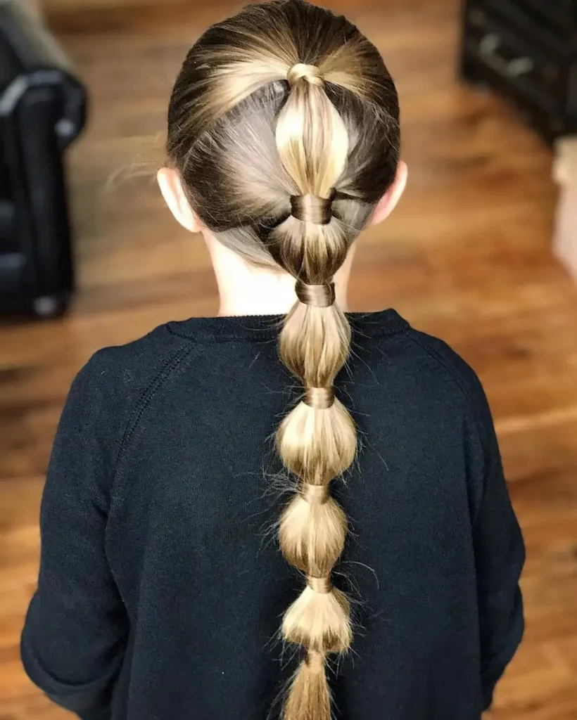 16 Gymnastics Hairstyles That'll Have You Flipping With Confidence (Literally) 10 The Wrapped Ponytail with Ribbon