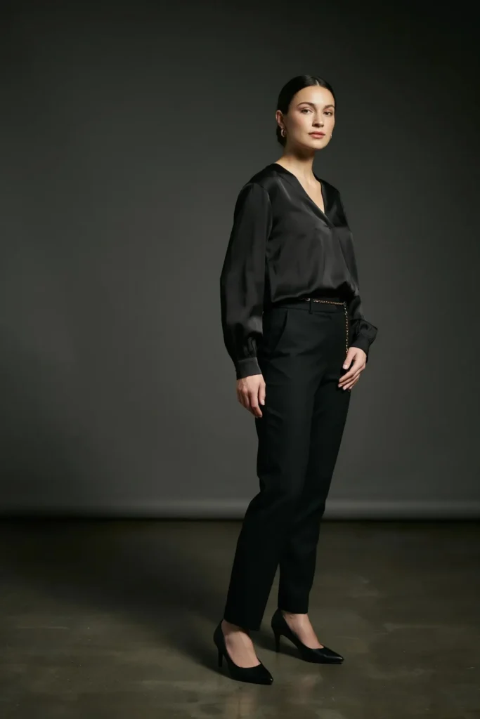 20 Black Outfit Ideas That Make Getting Dressed Feel Ridiculously Easy 11 Black Satin Blouse Tailored Trousers