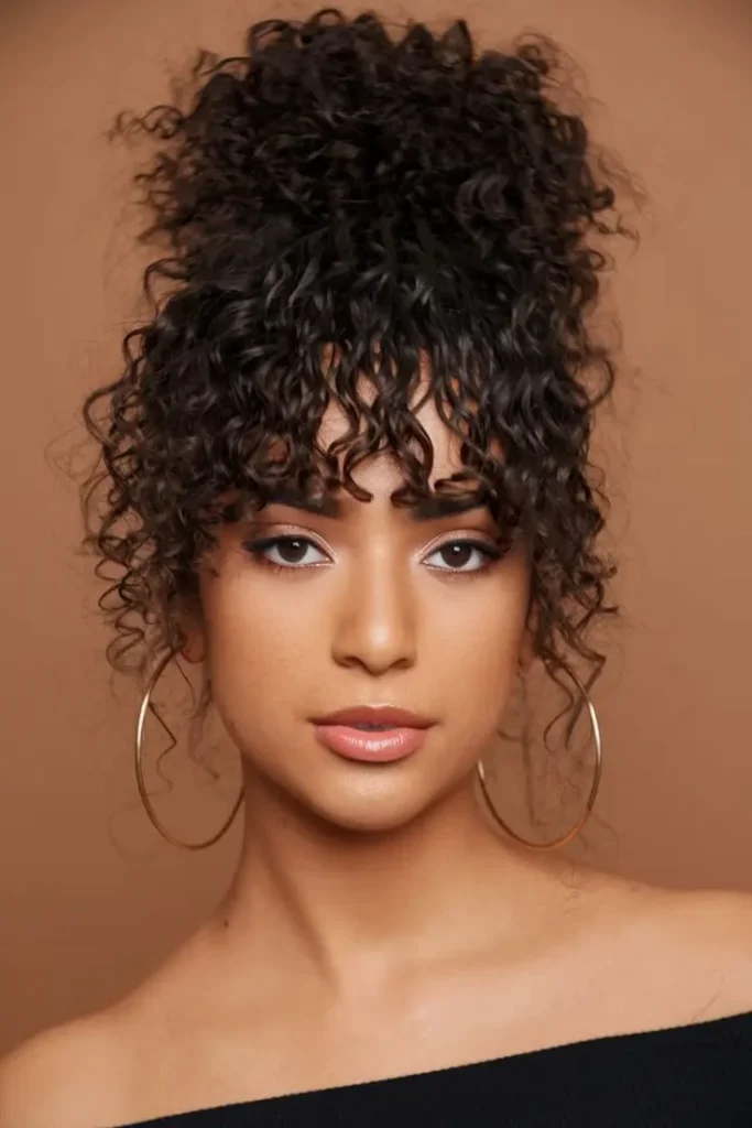 19 Cute Hairstyles for Curly Hair That'll Make You Fall in Love With Your Curls All Over Again 8 Curly Bangs With an Updo