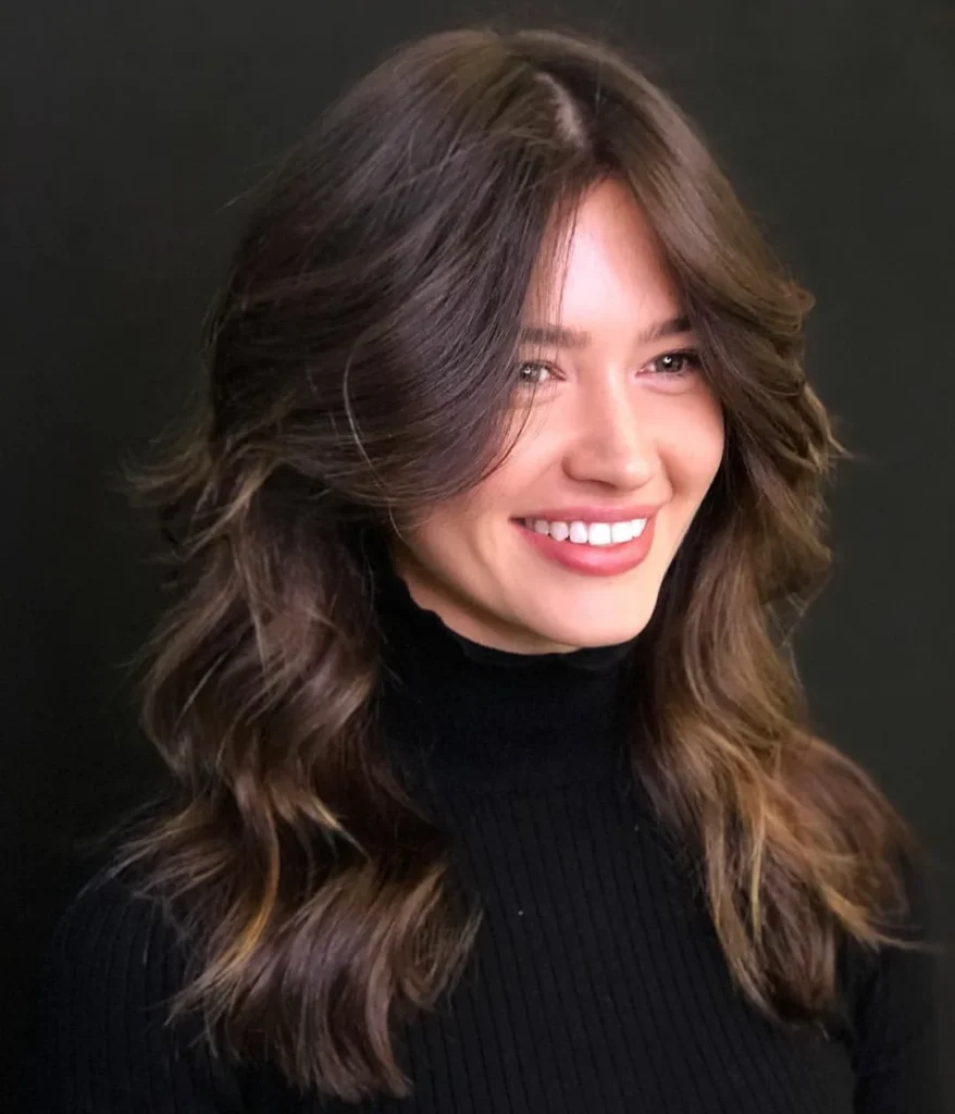 18 Bang Hairstyles That'll Make You Want to Grab Scissors ASAP 11 Feathered Bangs