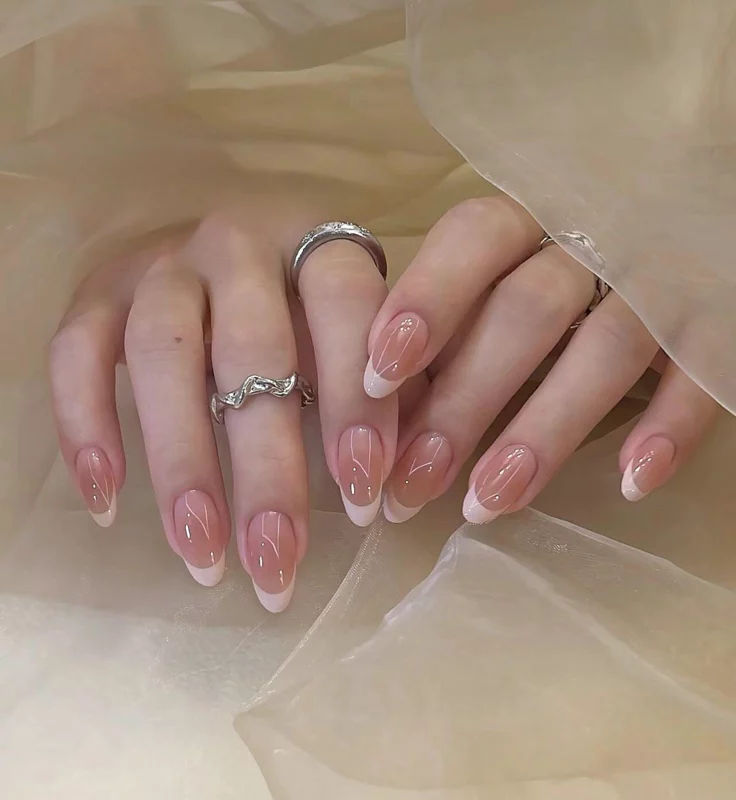 20 Pink Christmas Nail Ideas That Are Way More Fun Than Red & Green (Trust Me) 2 Frosted Blush Tips The Minimalists Dream