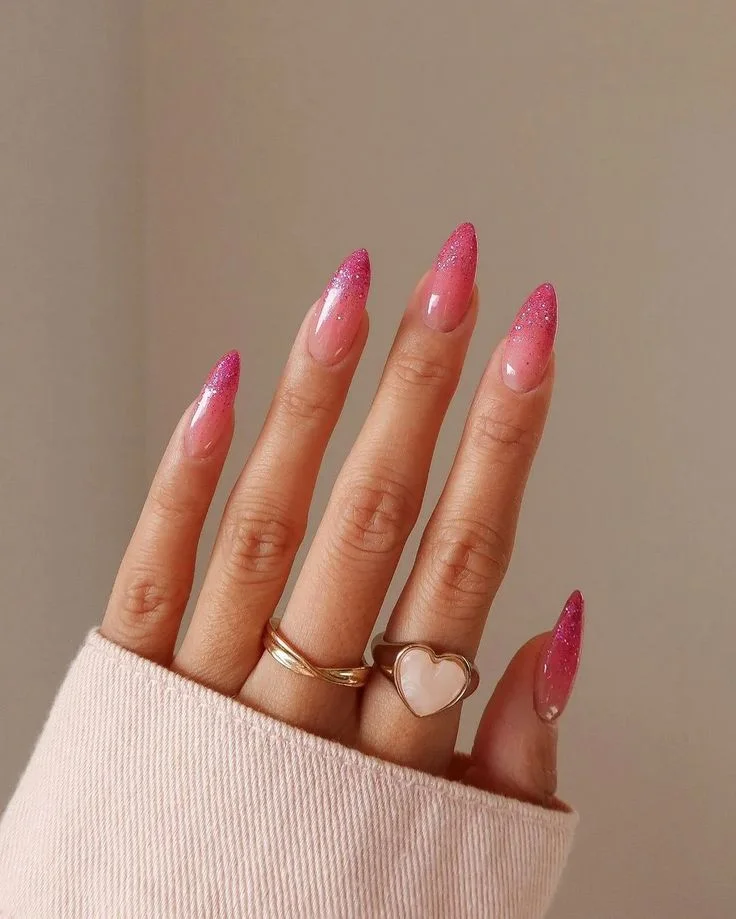 20 Pink Christmas Nail Ideas That Are Way More Fun Than Red & Green (Trust Me) 3 Hot Pink Glitter Ombre Party Mode Activated