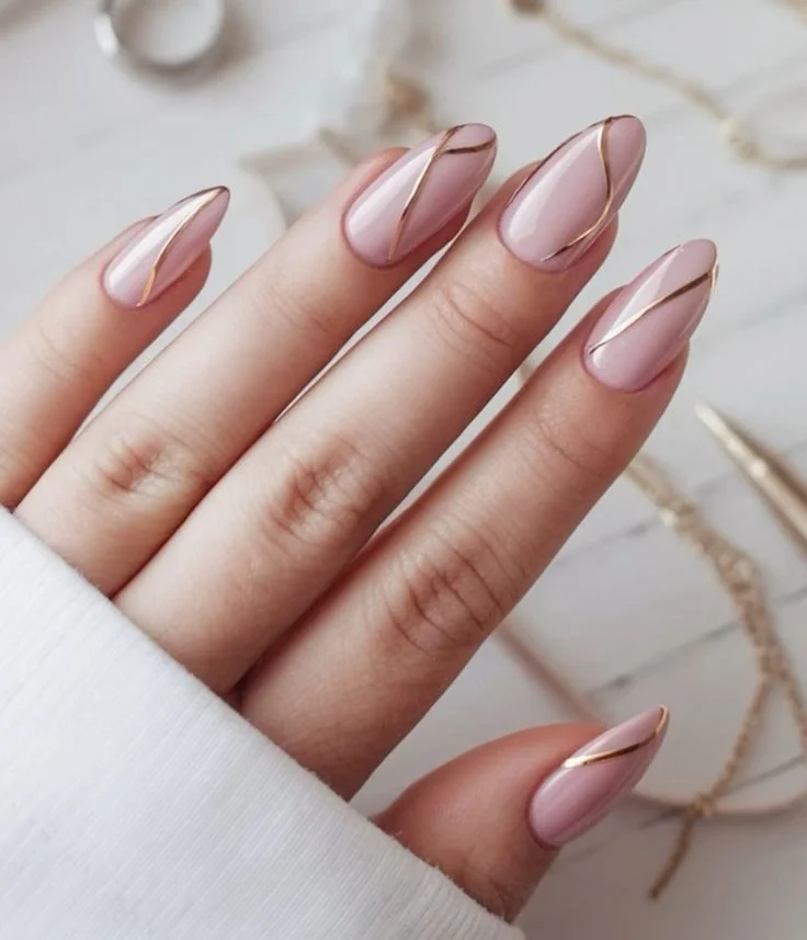 20 Pink Christmas Nail Ideas That Are Way More Fun Than Red & Green (Trust Me) 4 Matte Pink Gold Stripes