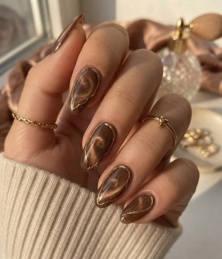 Fall Gets a Little More Magical With These 14 Fall Cat Eye Nails 13 Brown and Gold Cat Eye