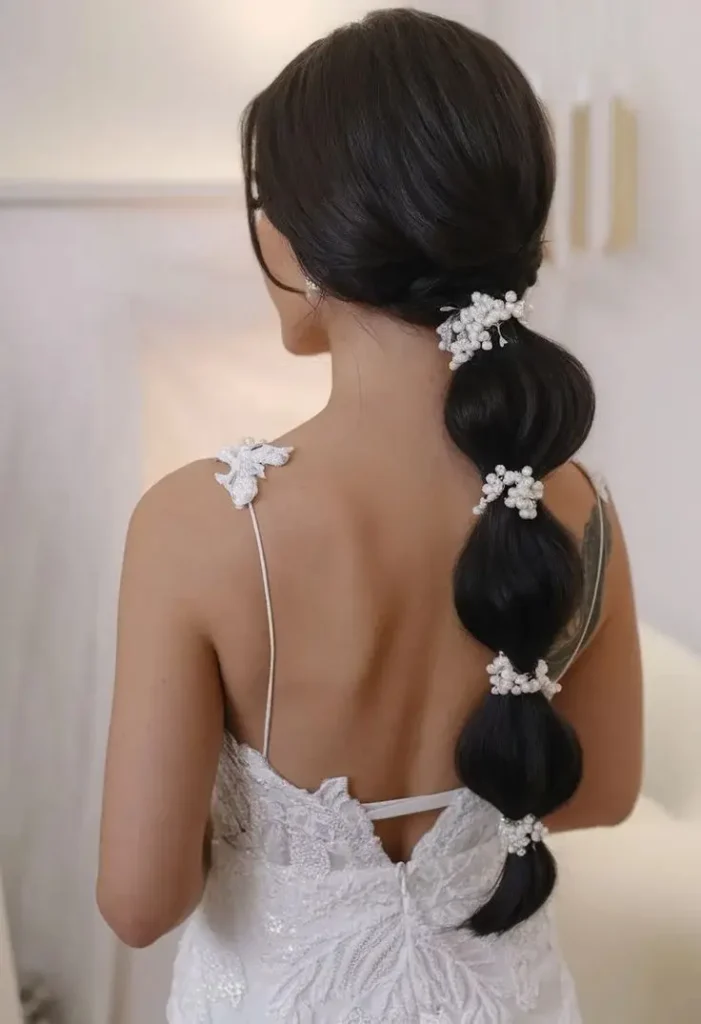 The Bridal Lookbook: 18 Wedding Hairstyles with Veil That Feel Truly Special 16 Bubble Ponytail with a Veil