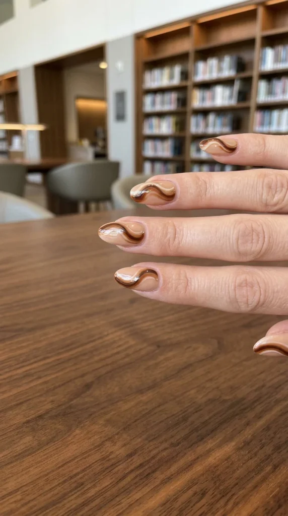 15 Fall Nail Ideas for a Cozy Autumn Manicure You’ll Love 7 Caramel Swirl Nail Art