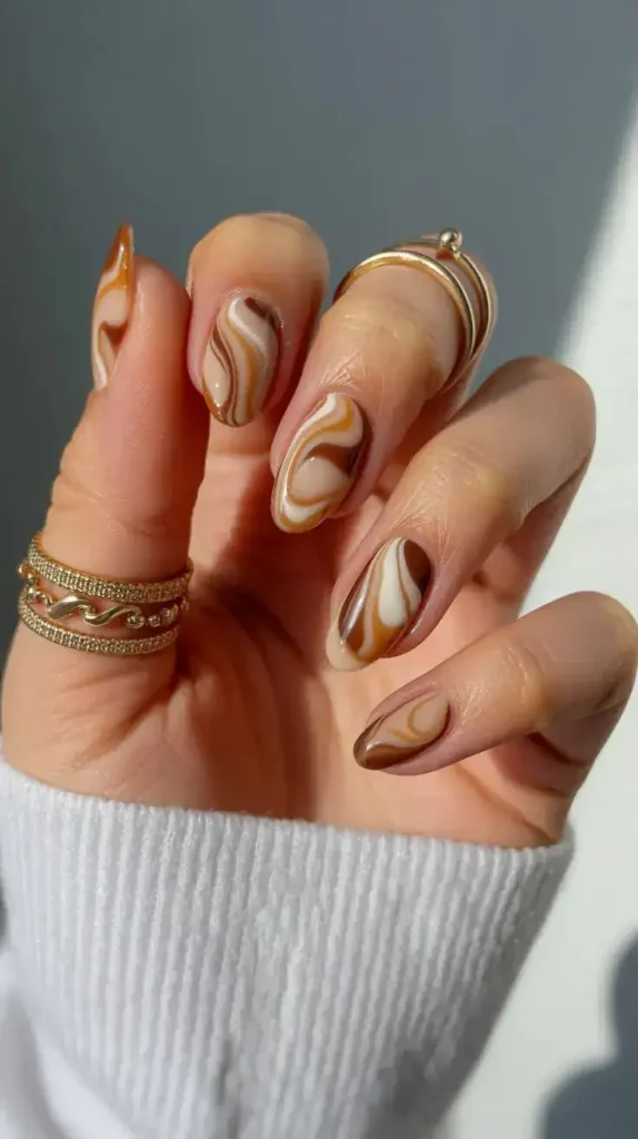 16 Fall Coffin Nails That Make Autumn Manicures Feel Extra Stylish 6 Caramel Swirl Nails 1